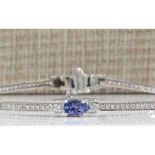 3.75 CTW Natural Tanzanite And Dimond Bracelet In 18K Solid White Gold: 3.75 CTW Natural Tanzanite And Dimond Bracelet In 18K Solid White Gold Manufacturer's Suggested Retail Price: $ 3900.00 Stamped: 18K Bracelet Width: 4.80mm Bracelet Length: 7.0 Inches 