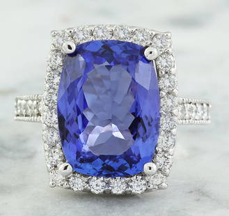 8.55 CTW Tanzanite 14K White Gold Diamond Ring: 8.55 CTW Tanzanite 14K White Gold Diamond Ring Manufacturer's Suggested Retail Price: $ 7000.00 Stamped: 14K Total Ring Weight: 6 Grams Tanzanite Weight: 7.65 Carat (14.00x12.00 Millimeters) 