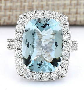 9.36 CTW Natural Aquamarine And Diamond Ring In 18K White Gold: 9.36 CTW Natural Aquamarine And Diamond Ring In 18K White Gold Manufacturer's Suggested Retail Price: $ 5400.00 Stamped: 18K Ring Size: 7 Total Ring Weight: 7.5 Grams Diamond Weight: 