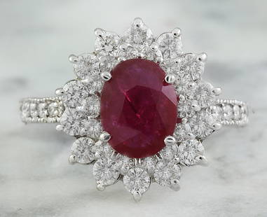 3.20 CTW Ruby 14K White Gold Diamond Ring: 3.20 CTW Ruby 14K White Gold Diamond Ring Manufacturer's Suggested Retail Price: $ 4000.00 Stamped: 14K Total Ring Weight: 5 Grams Ruby Weight 1.80 Carat (9.00x7.00 Millimeters) Diamond