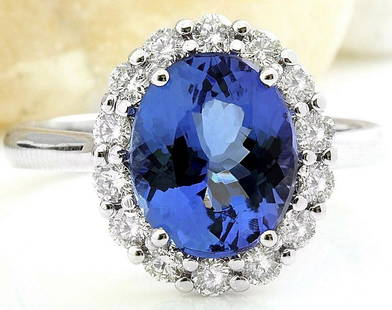 4.80 CTW Natural Tanzanite 14K Solid White Gold Diamond Ring: 4.80 CTW Natural Tanzanite 14K Solid White Gold Diamond Ring Manufacturer's Suggested Retail Price: $ 5000.00 4.80 Carat Natural Tanzanite 14K Solid White Gold Diamond Ring Item Type: Ring 