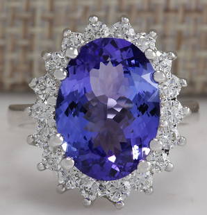 6.80 CTW Natural Blue Tanzanite And Diamond Ring 18K Solid White Gold: 6.80 CTW Natural Blue Tanzanite And Diamond Ring 18K Solid White Gold Manufacturer's Suggested Retail Price: $ 6800.00 Stamped: 18K Ring Size: 6.75 Total Ring Weight: 6.4 Grams Diamond