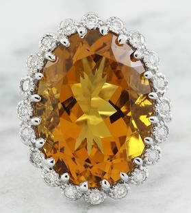 15.50 CTW Citrine 18K White Gold Diamond Ring: 15.50 CTW Citrine 18K White Gold Diamond Ring Manufacturer's Suggested Retail Price: $ 3100.00 Stamped: 18K Total Ring Weight: 6 Grams Citrine Weight 14.70 Carat (19.85x14.75 Millimeters)