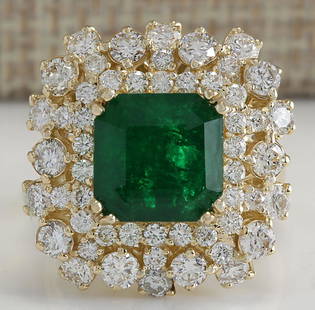 7.02CTW Natural Emerald And Diamond Ring 14K Solid Yellow Gold: 7.02CTW Natural Emerald And Diamond Ring 14K Solid Yellow Gold Manufacturer's Suggested Retail Price: $ 8600.00 Stamped: 14K Ring Size: 6.75 Total Ring Weight: 11 Grams Diamond Weight: 