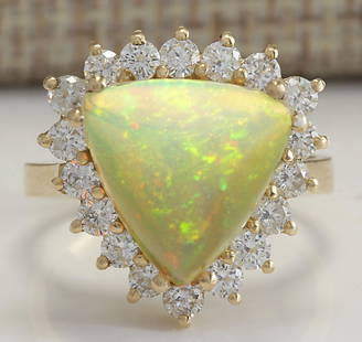 4.77 CTW Natural Opal And Diamond Ring In 18K Solid Yellow Gold: 4.77 CTW Natural Opal And Diamond Ring In 18K Solid Yellow Gold Manufacturer's Suggested Retail Price: $ 4300.00 Stamped: 18K Ring Size: 6.25 Total Ring Weight: 5.3 Grams Diamond Weight: 