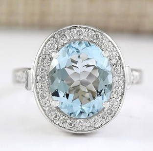 3.95 CTW Natural Aquamarine And Diamond Ring In 14k White Gold: 3.95 CTW Natural Aquamarine And Diamond Ring In 14k White Gold Manufacturer's Suggested Retail Price: $ 4000.00 Stamped: 14K Ring Size: 6 Total Ring Weight: 5.9 Grams Diamond Weight: 