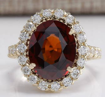 10.43 CTW Natural Hessonite Garnet And Diamond Ring 18K Solid Yellow Gold: 10.43 CTW Natural Hessonite Garnet And Diamond Ring 18K Solid Yellow Gold Manufacturer's Suggested Retail Price: $ 13100.00 Stamped: 18K Ring Size: 6.5 Total Ring Weight: 5.5 Grams Diamond