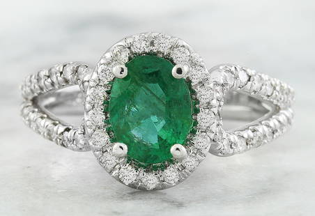 1.70 CTW Emerald 18K White Gold Diamond Ring: 1.70 CTW Emerald 18K White Gold Diamond Ring Manufacturer's Suggested Retail Price: $ 4000.00 Stamped: 18K Total Ring Weight: 5.6 Grams Emerald Weight 1.20 Carat (8.00x6.00 Millimeters)