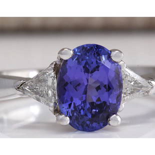2.55 CTW Natural Blue Tanzanite And Diamond Ring In 18K White Gold: 2.55 CTW Natural Blue Tanzanite And Diamond Ring In 18K White Gold Manufacturer's Suggested Retail Price: $ 4100.00 Stamped: 18K Ring Size: 6.5 Total Ring Weight: 4.6 Grams Diamond Weight: 
