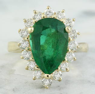 4.55 CTW Emerald 14K Yellow Gold Diamond Ring: 4.55 CTW Emerald 14K Yellow Gold Diamond Ring Manufacturer's Suggested Retail Price: $ 5300.00 Stamped: 14K Total Ring Weight: 5.1 Grams Emerald Weight: 3.60 Carat (14.00x9.00 Millimeters) 