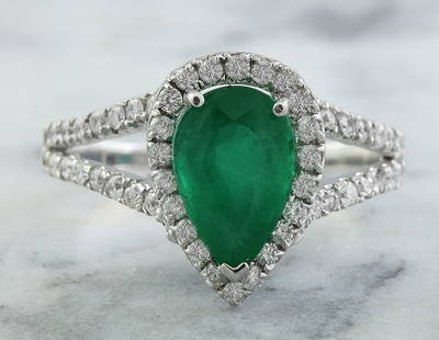2.65 CTW Emerald 14K White Gold Diamond Ring: 2.65 CTW Emerald 14K White Gold Diamond Ring Manufacturer's Suggested Retail Price: $ 3100.00 Stamped: 14K Ring Size: 7 Total Ring Weight: 3.2 Grams Emerald Weight: 2.10 Carat (10.00x6.50