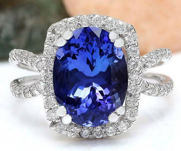 5.11 CTW Natural Tanzanite 18K Solid White Gold Diamond Ring: 5.11 CTW Natural Tanzanite 18K Solid White Gold Diamond Ring Manufacturer's Suggested Retail Price: $ 5100.00 5.11 Carat Natural Tanzanite 18K Solid White Gold Diamond Ring Item Type: Ring 