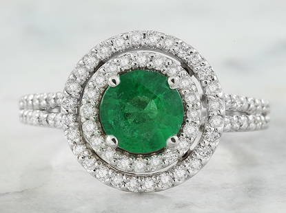 2.45 CTW Emerald 14K White Gold Diamond Ring: 2.45 CTW Emerald 14K White Gold Diamond Ring Manufacturer's Suggested Retail Price: $ 3200.00 Stamped: 14K Total Ring Weight: 4.3 Grams Emerald Weight 1.80 Carat (6.75x6.75 Millimeters)