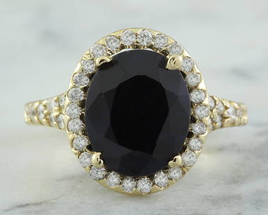 5.12 CTW Sapphire 14K Yellow Gold Diamond Ring: 5.12 CTW Sapphire 14K Yellow Gold Diamond Ring Manufacturer's Suggested Retail Price: $ 4500.00 Stamped: 14K Ring Size: 7 Total Ring Weight: 4.4 Grams Sapphire Weight: 4.50 Carat (11.00x9.00
