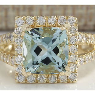 4.13 CTW Natural Aquamarine And Diamond Ring In 18K Solid Yellow Gold: 4.13 CTW Natural Aquamarine And Diamond Ring In 18K Solid Yellow Gold Manufacturer's Suggested Retail Price: $ 4000.00 Stamped: 18K Ring Size: 6.25 Total Ring Weight: 8 Grams Diamond Weight: