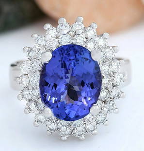 6.22 CTW Natural Tanzanite 14K Solid White Gold Diamond Ring: 6.22 CTW Natural Tanzanite 14K Solid White Gold Diamond Ring Manufacturer's Suggested Retail Price: $ 6200.00 6.22 Carat Natural Tanzanite 14K Solid White Gold Diamond Ring Item Type: Ring 