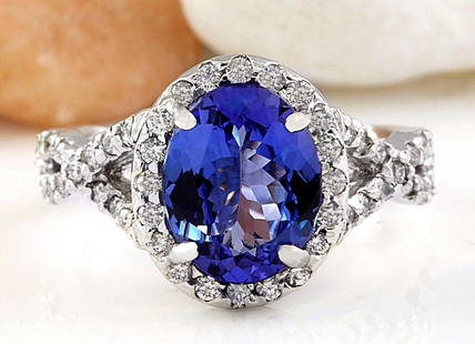 4.00 CTW Natural Tanzanite 18K Solid White Gold Diamond Ring: 4.00 CTW Natural Tanzanite 18K Solid White Gold Diamond Ring Manufacturer's Suggested Retail Price: $ 5300.00 4.00 Carat Natural Tanzanite 18K Solid White Gold Diamond Ring Item Type: Ring 