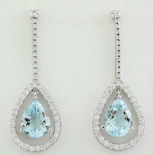 7.70 CTW Aquamarine 18K White Gold Diamond Earrings: 7.70 CTW Aquamarine 18K White Gold Diamond Earrings Manufacturer's Suggested Retail Price: $ 5400.00 Stamped: 18K Total Earrings Weight: 6.4 Grams Aquamarine Weight: 5.90 Carat (11.65x9.00