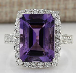 7.09 CTW Natural Amethyst And Diamond Ring In 14K Solid White Gold: 7.09 CTW Natural Amethyst And Diamond Ring In 14K Solid White Gold Manufacturer's Suggested Retail Price: $ 3800.00 Stamped: 14K Ring Size: 6.75 Total Ring Weight: 6 Grams Diamond Weight: 