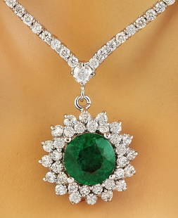 7.55 CTW Emerald 14K White Gold Diamond Necklace: 7.55 CTW Emerald 14K White Gold Diamond Necklace Manufacturer's Suggested Retail Price: $ 12400.00 Stamped: 585 Total Necklace Weight: 22.7 Grams Necklace Length: 16.5 Inches Center Emerald