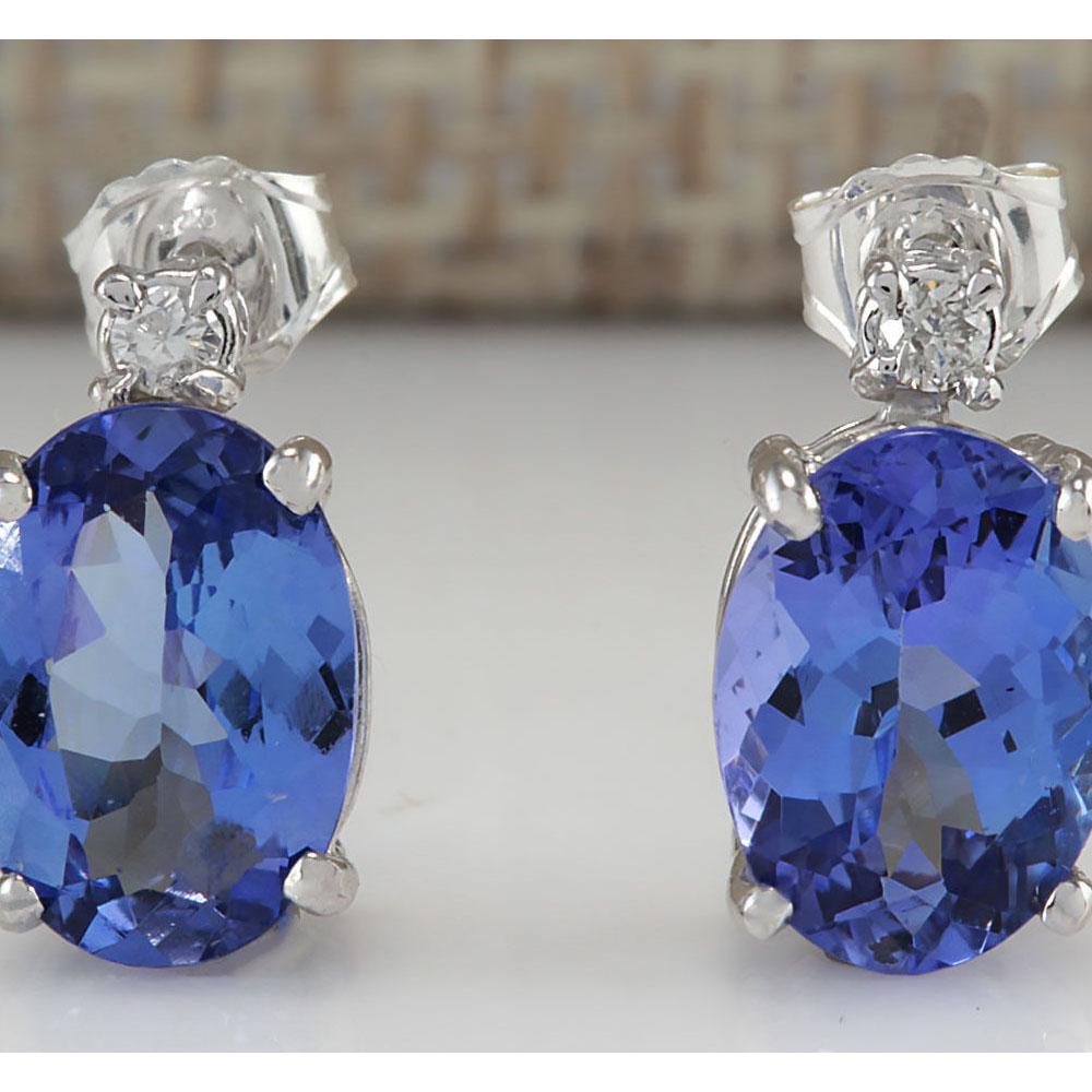 3.26 CTW Natural Tanzanite And Diamond Earrings 18K Solid White Gold: 3.26 CTW Natural Tanzanite And Diamond Earrings 18K Solid White Gold Manufacturer's Suggested Retail Price: $ 2200.00 Stamped: 18K Total Earring Weight: 1.6Grams Diamond Weight: Total Natural diamond 