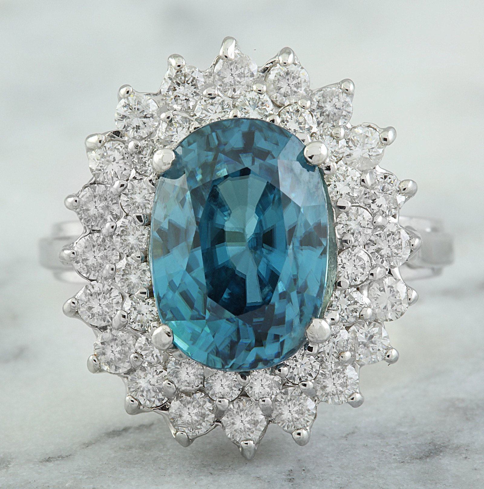 8.52 CTW Zircon 18K White Gold Diamomd Ring: 8.52 CTW Zircon 18K White Gold Diamomd Ring Manufacturer's Suggested Retail Price: $ 5100.00 Stamped: 18K Ring Size: 7 Total Ring Weight: 7.4 Grams Zircon Weight: 7.22 Carat (11.80x8.20 Millimeter) Di