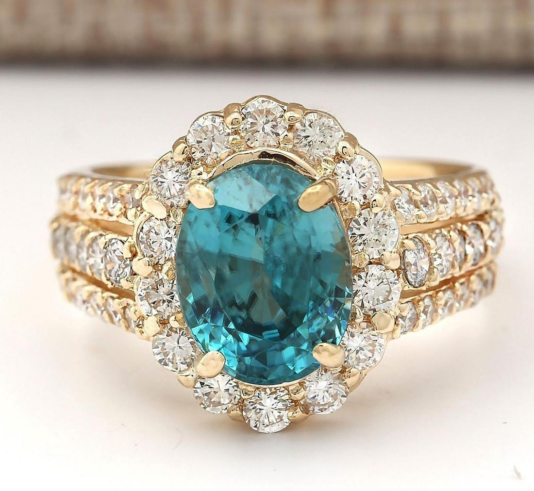 5.89 CTW Natural Blue Zircon And Diamond Ring 18K Solid Yellow Gold: 5.89 CTW Natural Blue Zircon And Diamond Ring 18K Solid Yellow Gold Manufacturer's Suggested Retail Price: $ 5100.00 Stamped: 18K Ring Size: 7 Total Ring Weight: 9.3 Grams Diamond Weight: Total Natura
