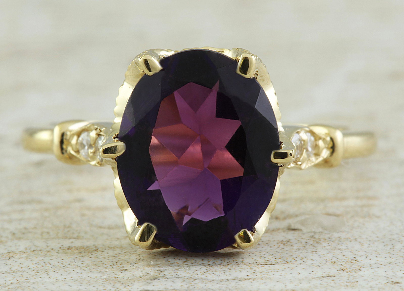 3.41 CTW Amethyst 18K Yellow Gold Diamond Ring: 3.41 CTW Amethyst 18K Yellow Gold Diamond Ring Manufacturer's Suggested Retail Price: $ 2100.00 Stamped: 18K Total Ring Weight: 4.2 Grams Amethyst Weight: 3.26 Carat (11.00x9.00 Millimeters) Diamond W