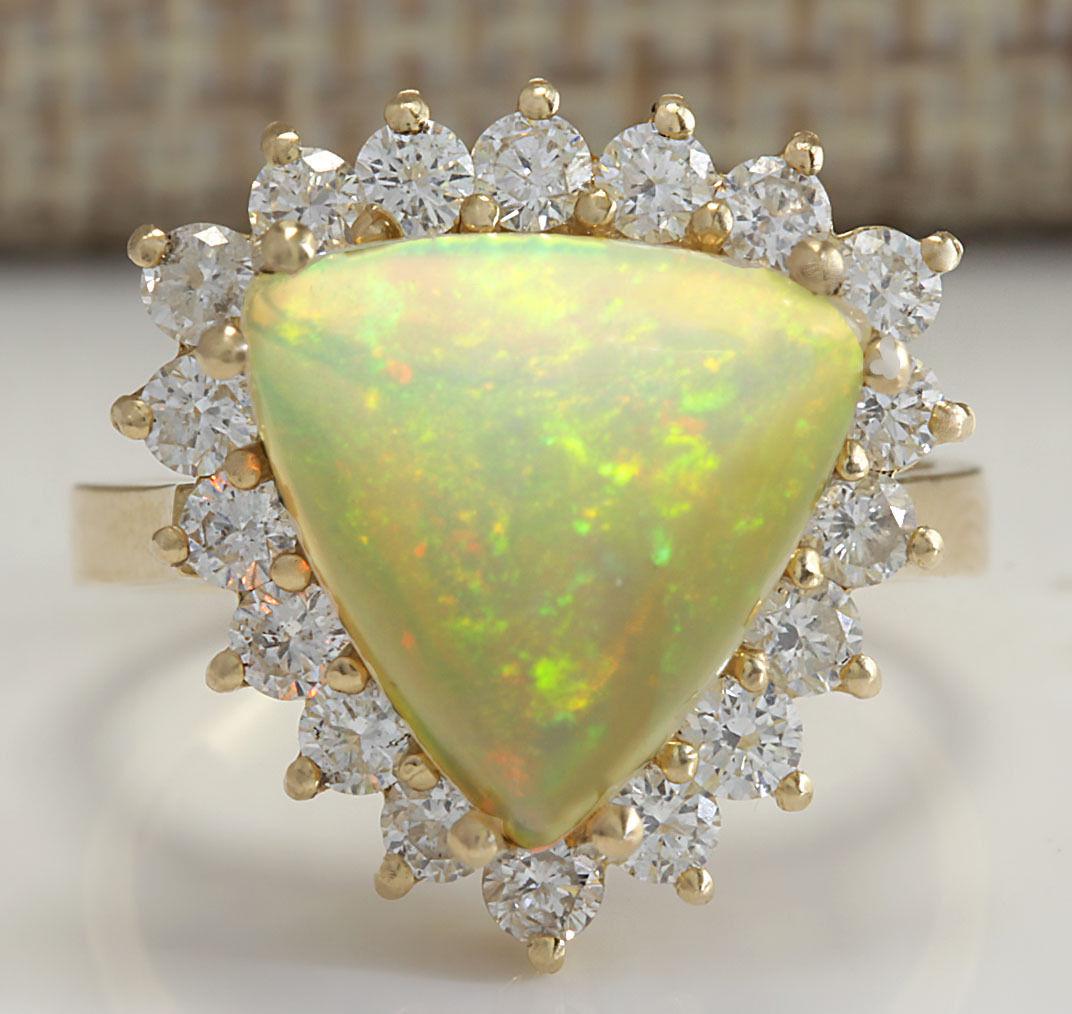 4.77 CTW Natural Opal And Diamond Ring In 18K Solid Yellow Gold: 4.77 CTW Natural Opal And Diamond Ring In 18K Solid Yellow Gold Manufacturer's Suggested Retail Price: $ 4300.00 Stamped: 18K Ring Size: 6.25 Total Ring Weight: 5.3 Grams Diamond Weight: Total Natural