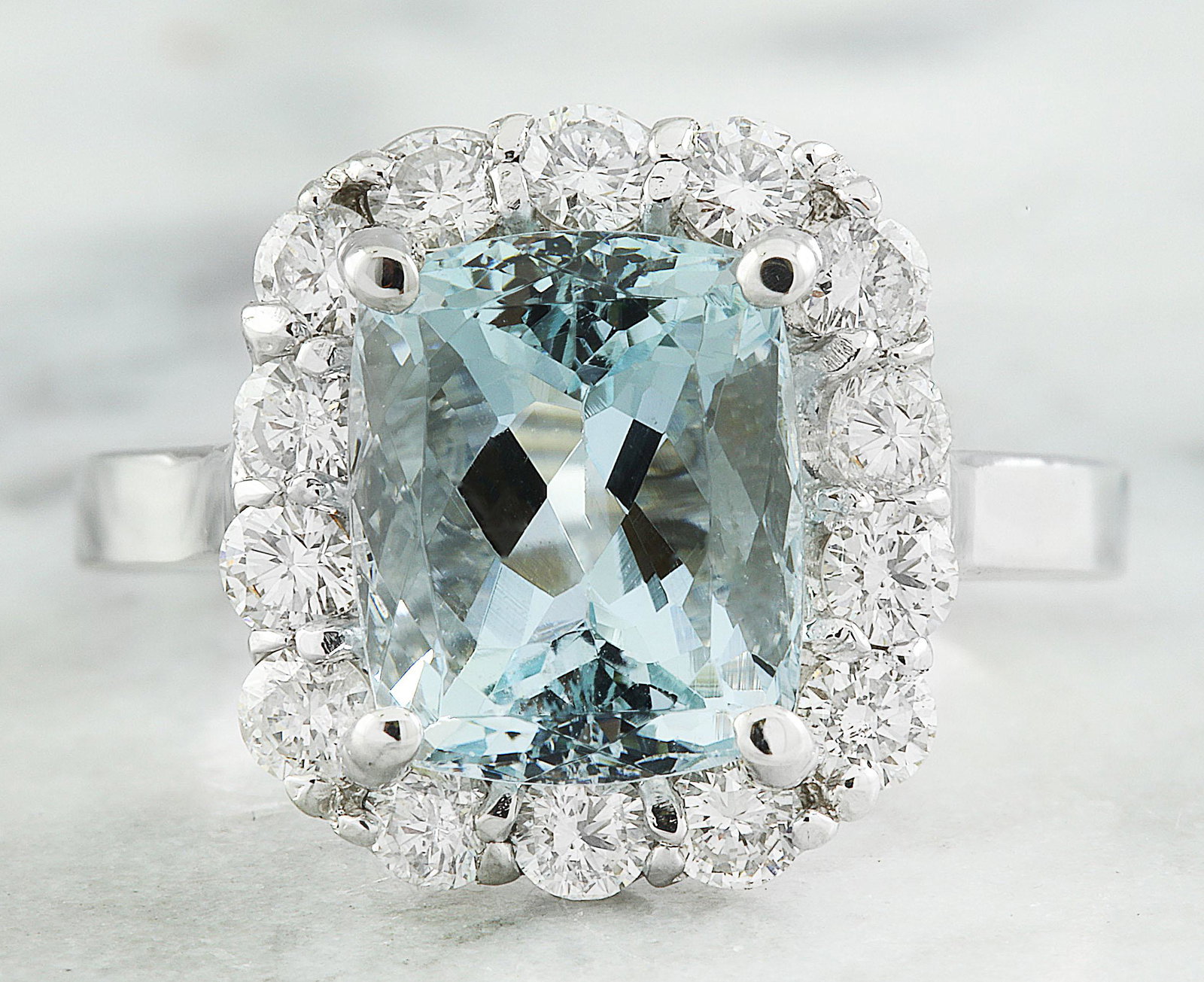 4.55 CTW Aquamarine 18K White Gold Diamond Ring: 4.55 CTW Aquamarine 18K White Gold Diamond Ring Manufacturer's Suggested Retail Price: $ 4100.00 Stamped: 18K Total Ring Weight: 5.5 Grams Aquamarine Weight 3.50 Carat (10.00x8.00 Millimeters) Diamond