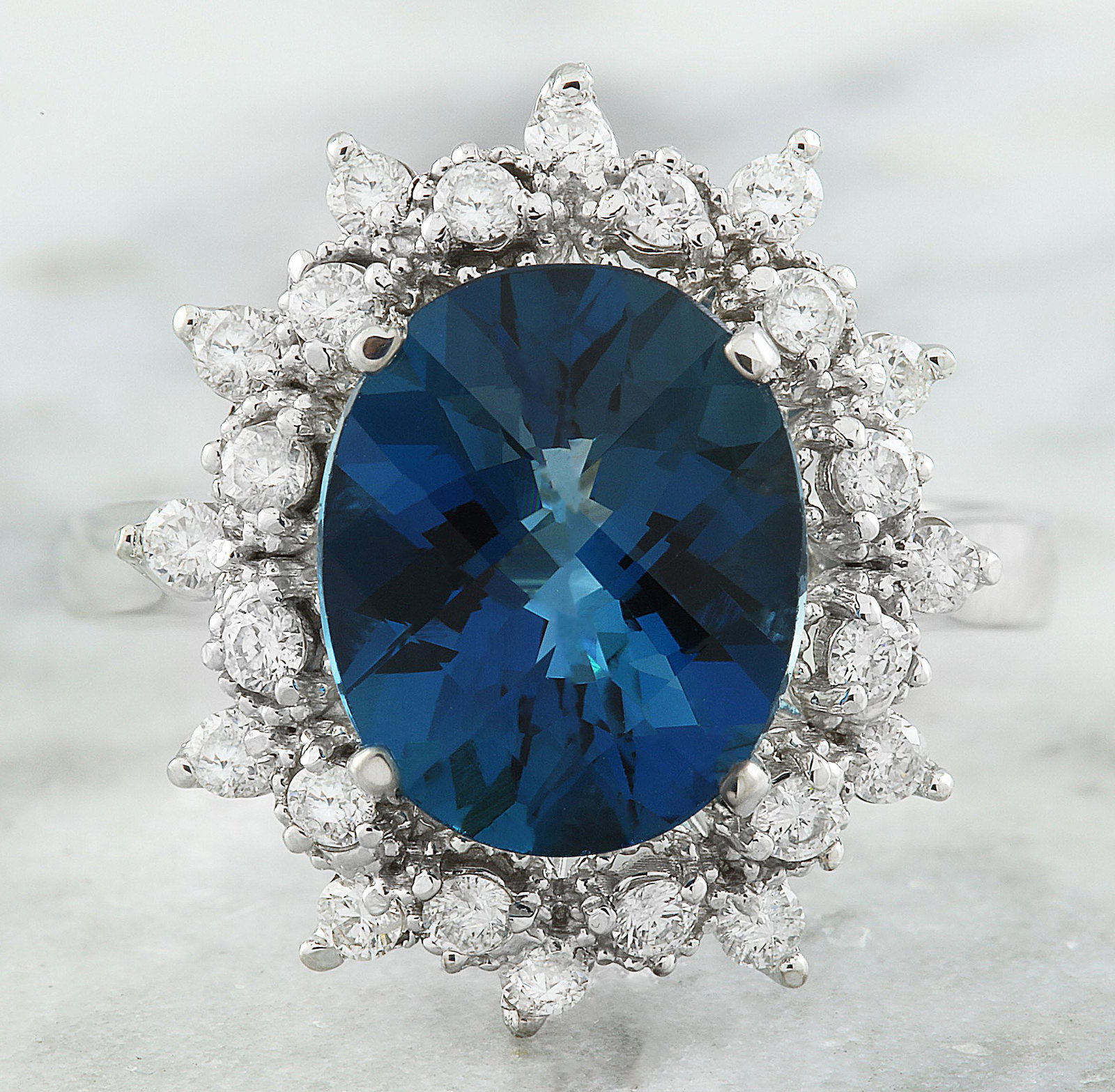 4.35 CTW Topaz 18K White Gold Diamond Ring: 4.35 CTW Topaz 18K White Gold Diamond Ring Manufacturer's Suggested Retail Price: $ 2700.00 Stamped: 18K Total Ring Weight: 4.7 Grams Topaz Weight 3.90 Carat (10.85x9.00 Millimeters) Diamond Weight: 0