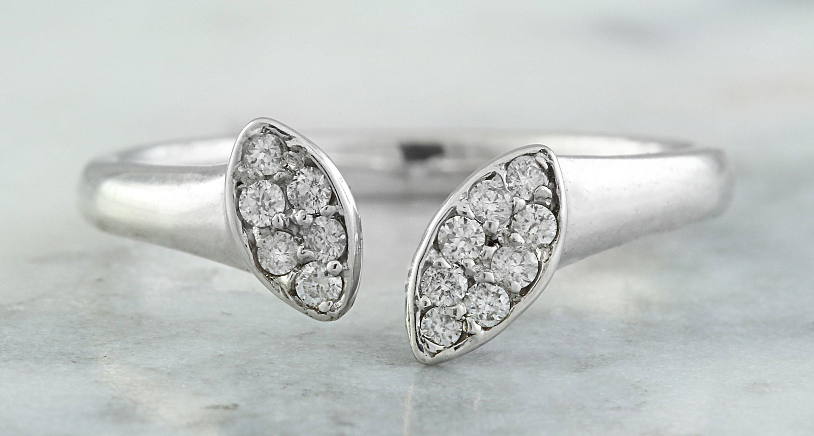 0.15 CTW 18K White Gold Diamond Ring: 0.15 CTW 18K White Gold Diamond Ring Manufacturer's Suggested Retail Price: $ 1400.00 Stamped: 18K Ring Size: 7 Total Ring Weight: 2.6 Grams Diamond Weight: 0.15 Carat (F-G Color, VS2-SI1 Clarity) Fac