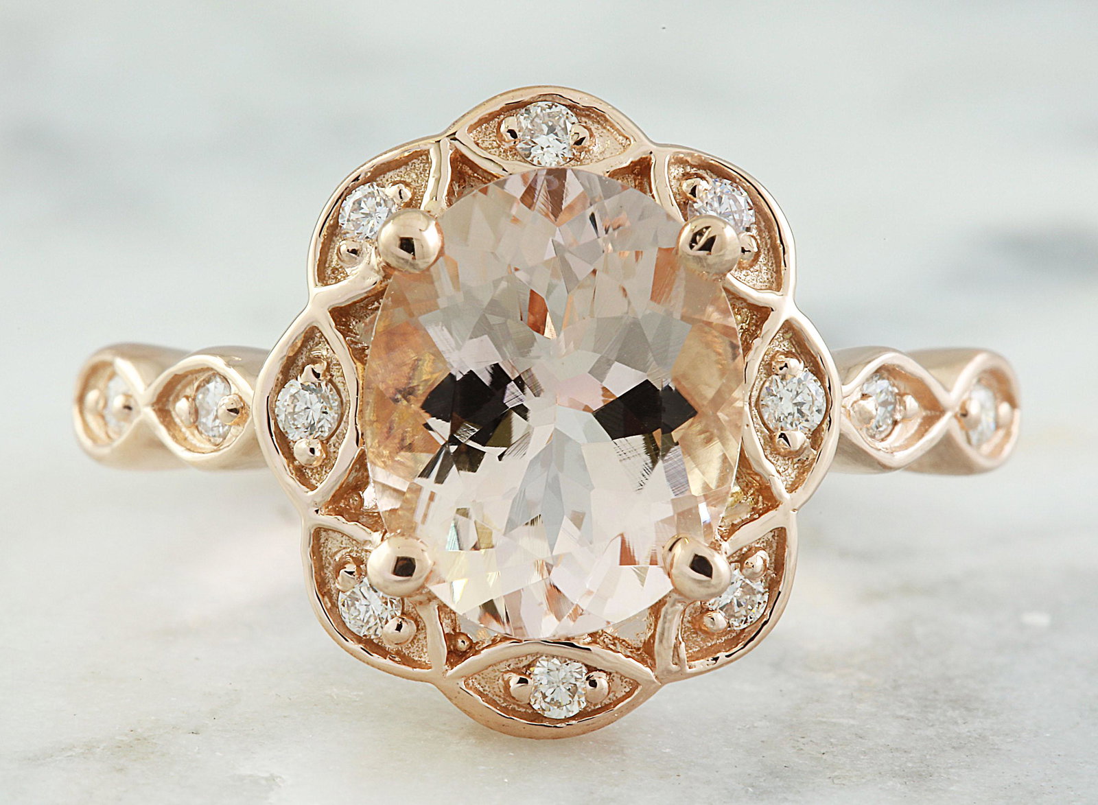 2.77 CTW Morganite 18K Rose Gold Diamond Ring: 2.77 CTW Morganite 18K Rose Gold Diamond Ring Manufacturer's Suggested Retail Price: $ 2900.00 Stamped: 18K Total Ring Weight: 4.8 Grams Morganite Weight: 2.52 Carat (10.00x8.00 Millimeters) Diamond W