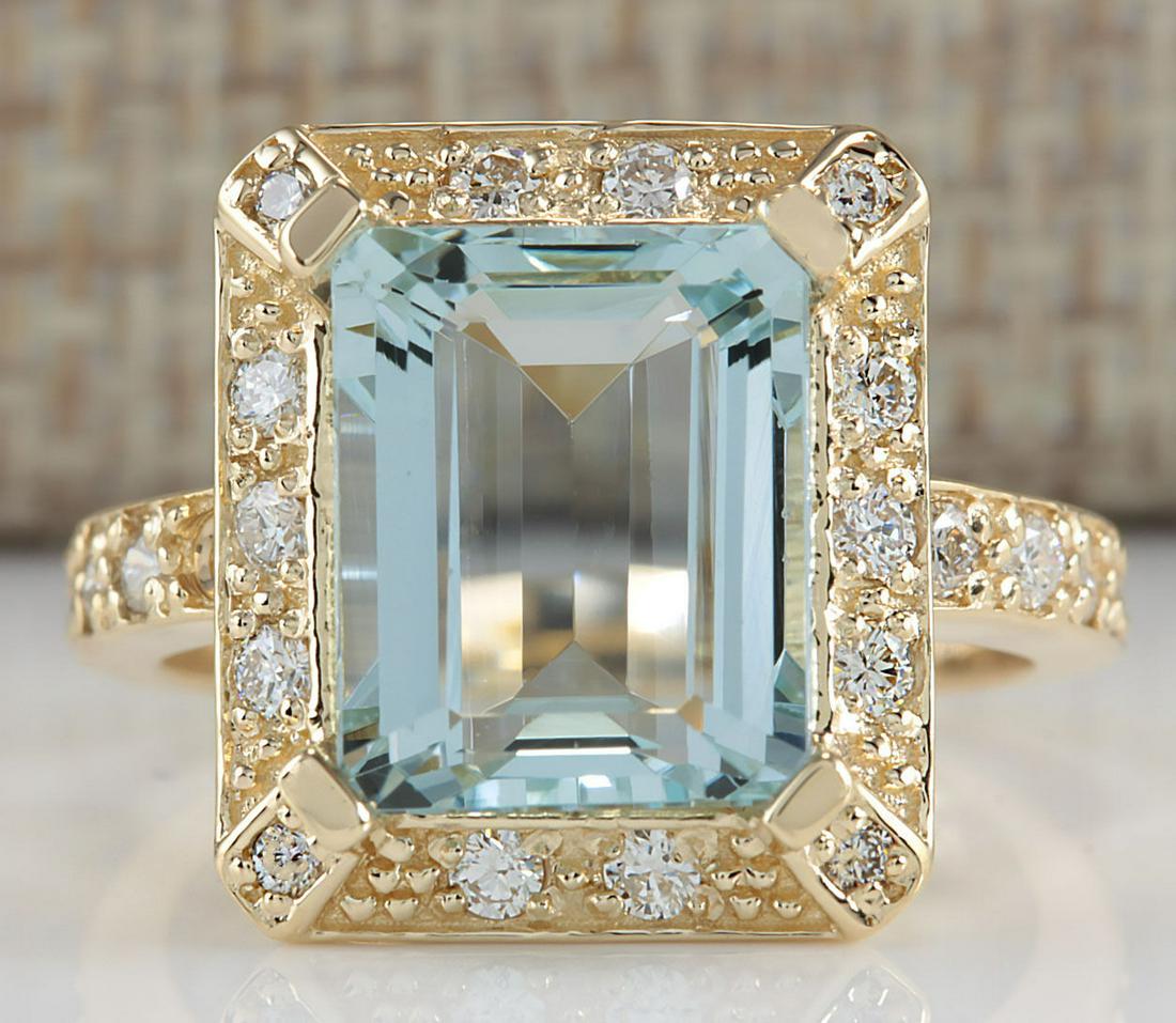4.85 CTW Natural Aquamarine And Diamond Ring In 18K Yellow Gold: 4.85 CTW Natural Aquamarine And Diamond Ring In 18K Yellow Gold Manufacturer's Suggested Retail Price: $ 3600.00 Stamped: 18K Ring Size: 6.75 Total Ring Weight: 7.4 Grams Diamond Weight: Total Natural