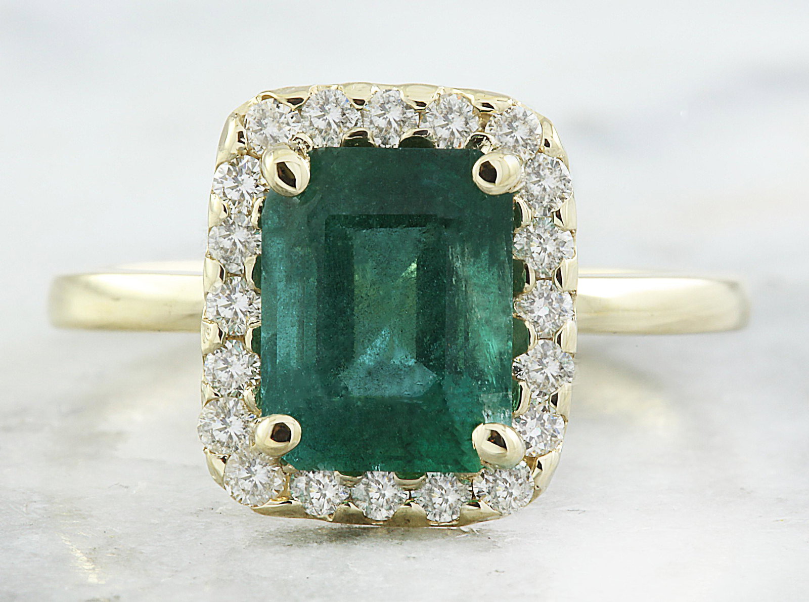 2.47 CTW Emerald 18K Yellow Gold Diamond Ring: 2.47 CTW Emerald 18K Yellow Gold Diamond Ring Manufacturer's Suggested Retail Price: $ 3900.00 Stamped: 18K Total Ring Weight: 2.9 Grams Emerald Weight 2.07 Carat (8.70x6.70 Millimeters) Diamond Weigh