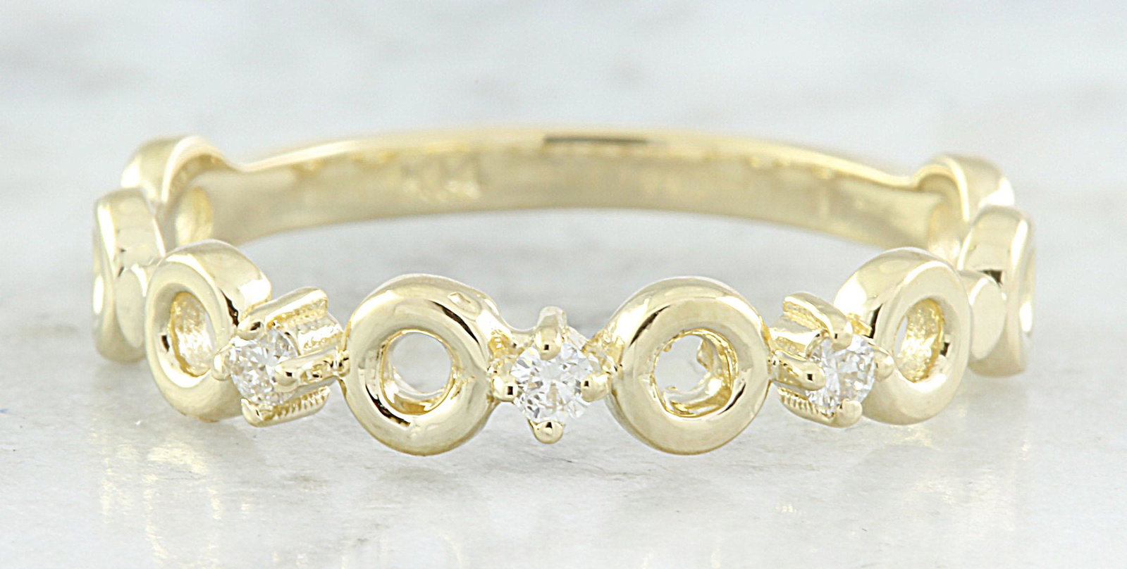 0.07 CTW Diamond 18K Yellow Gold Ring: 0.07 CTW Diamond 18K Yellow Gold Ring Manufacturer's Suggested Retail Price: $ 1200.00 Stamped: 18K Total Ring Weight: 1.7 Grams Diamond Weight: 0.07 carat (F-G Color, VS2-SI1 Clarity ) Face Measures: