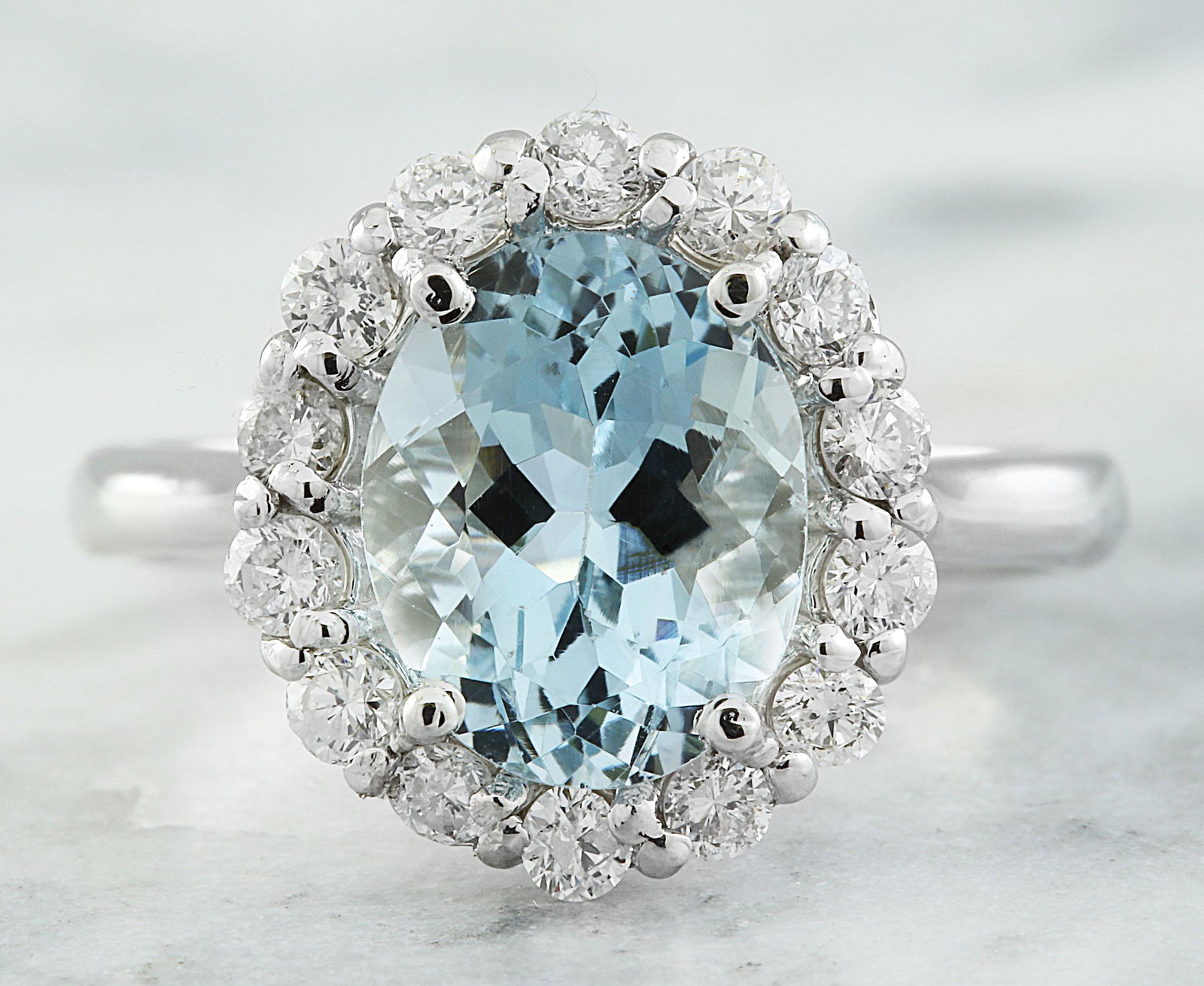 3.23 CTW Aquamarine 18K White Gold Diamond Ring: 3.23 CTW Aquamarine 18K White Gold Diamond Ring Manufacturer's Suggested Retail Price: $ 3600.00 Stamped: 18K Total Ring Weight: 3.9 Grams Aquamarine Weight: 2.63 Carat (10.00x8.20 Millimeters) Diamon