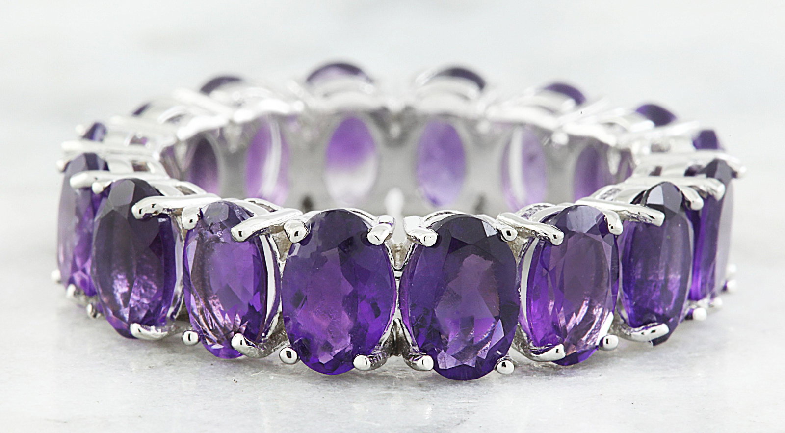 10.00 CTW Amethyst 18K White Gold Ring: 10.00 CTW Amethyst 18K White Gold Ring Manufacturer's Suggested Retail Price: $ 2300.00 Stamped: 18K Total Ring Weight: 6.3 Grams Amethyst Weight 6.00 Carat (7.00x5.00 Millimeters) Face Measures: 7.00