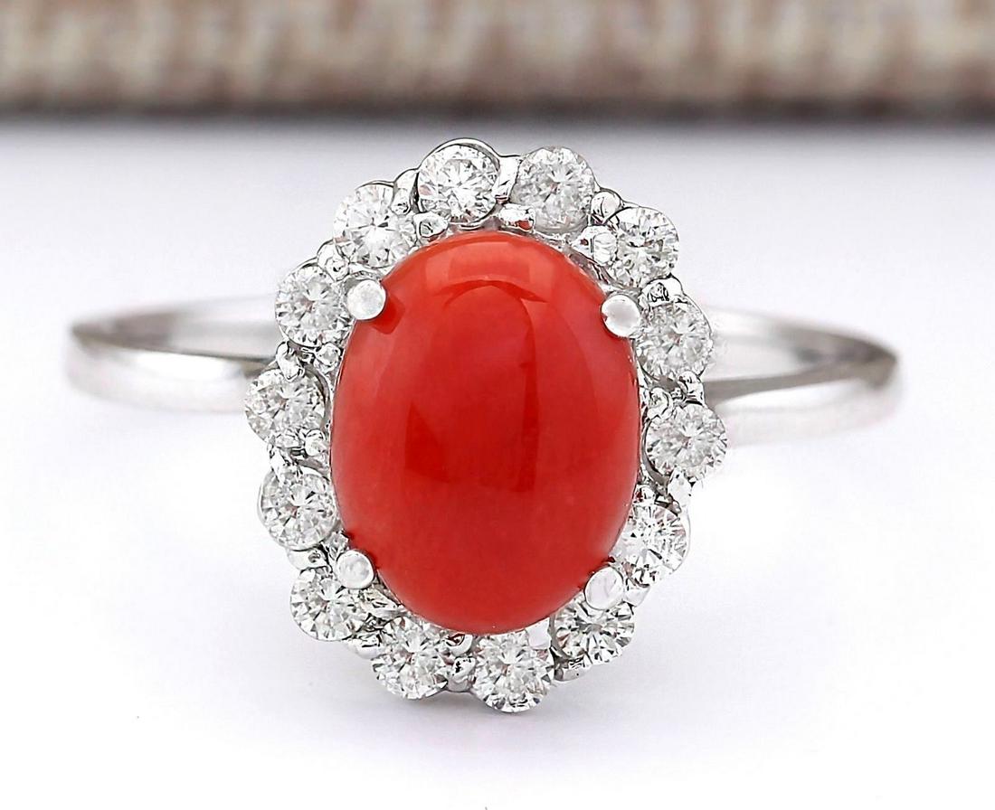 1.95 CTW Natural Coral And Diamond Ring In 18K White Gold: 1.95 CTW Natural Coral And Diamond Ring In 18K White Gold Manufacturer's Suggested Retail Price: $ 2500.00 Stamped: 18K Ring Size: 6.75 Total Ring Weight: 2.4 Grams Diamond Weight: Total Natural diamo