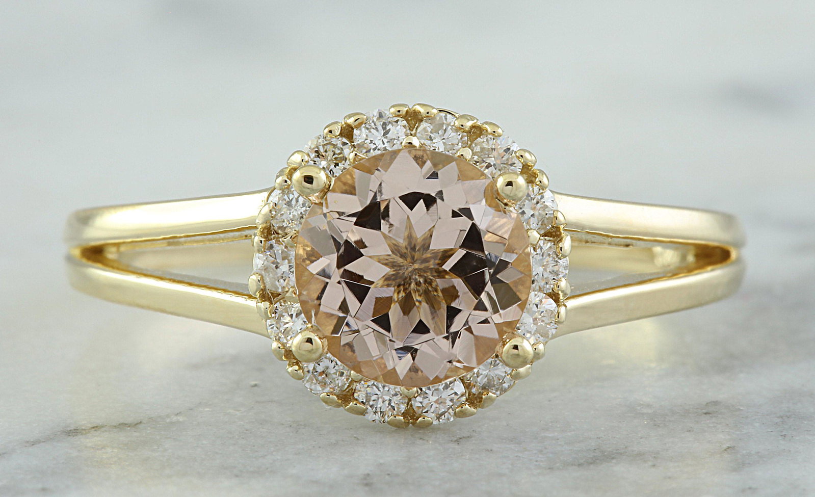 1.24 CTW Morganite 14K Yellow Gold Diamond Ring: 1.24 CTW Morganite 14K Yellow Gold Diamond Ring Manufacturer's Suggested Retail Price: $ 1900.00 Stamped: 14K Ring Size: 7 Total Ring Weight: 2.8 Grams Morganite Weight: 1.00 Carat (6.80x6.80 Millimet