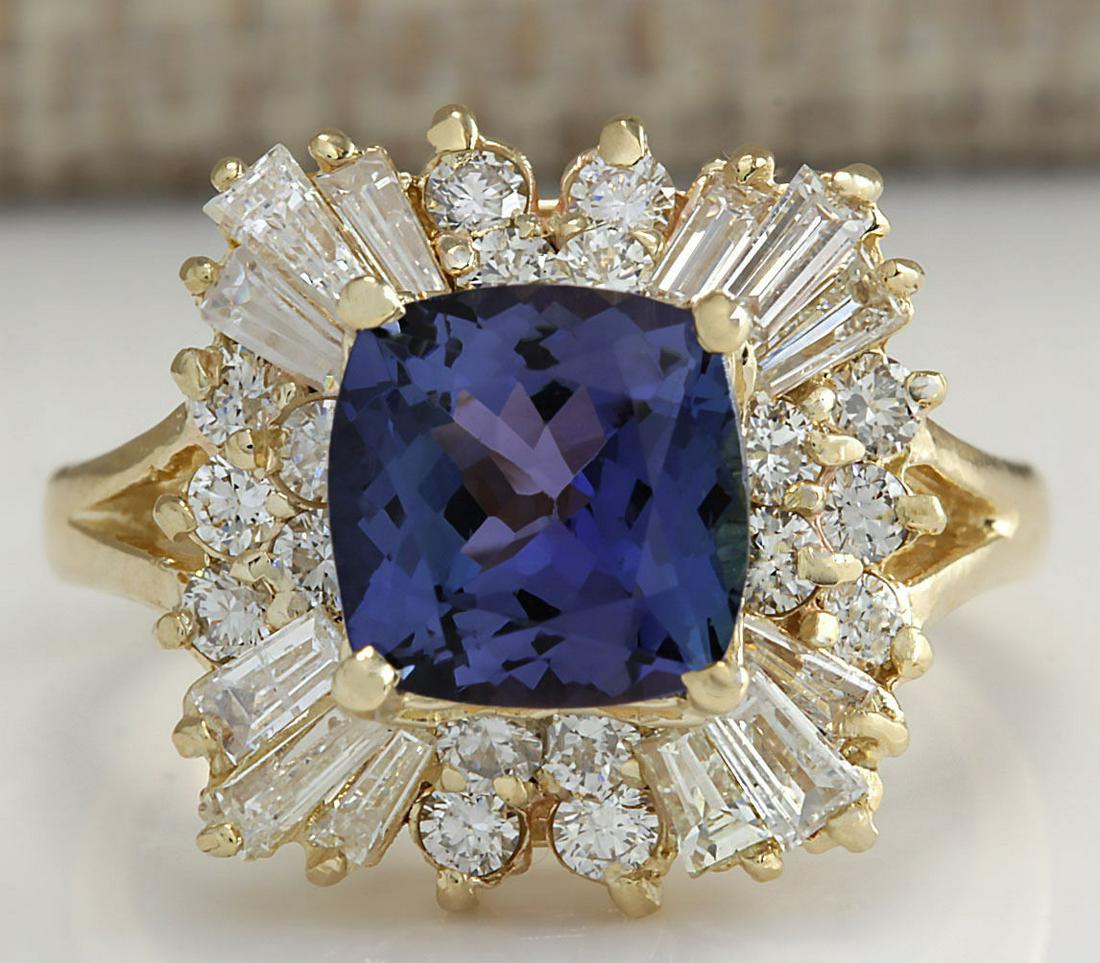 3.44 CTW Natural Blue Tanzanite And Diamond Ring 14K Solid Yellow Gold: 3.44 CTW Natural Blue Tanzanite And Diamond Ring 14K Solid Yellow Gold Manufacturer's Suggested Retail Price: $ 4900.00 Stamped: 14K Ring Size: 6 Total Ring Weight: 5.2 Grams Diamond Weight: Total Nat