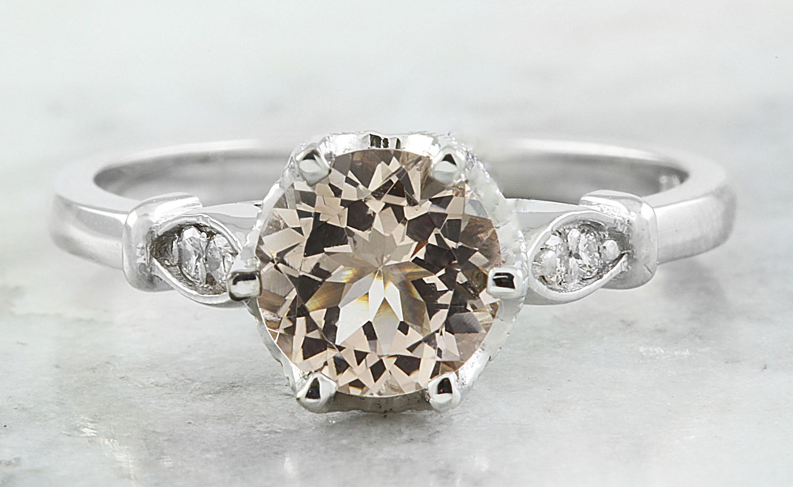 1.45 CTW Morganite 14K White Gold Diamond Ring: 1.45 CTW Morganite 14K White Gold Diamond Ring Manufacturer's Suggested Retail Price: $ 1500.00 Stamped: 14K Total Ring Weight: 3.4 Grams Morganite Weight 1.35 Carat (6.80x6.80 Millimeters) Diamond We