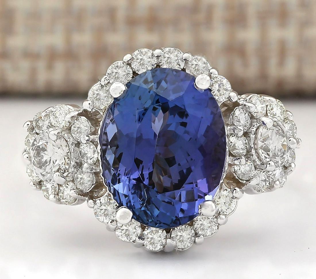 5.32 CTW Natural Blue Tanzanite And Diamond Ring 14k Solid White Gold: 5.32 CTW Natural Blue Tanzanite And Diamond Ring 14k Solid White Gold Manufacturer's Suggested Retail Price: $ 5400.00 Stamped: 14K Ring Size: 6.25 Total Ring Weight: 6.5 Grams Diamond Weight: Total N
