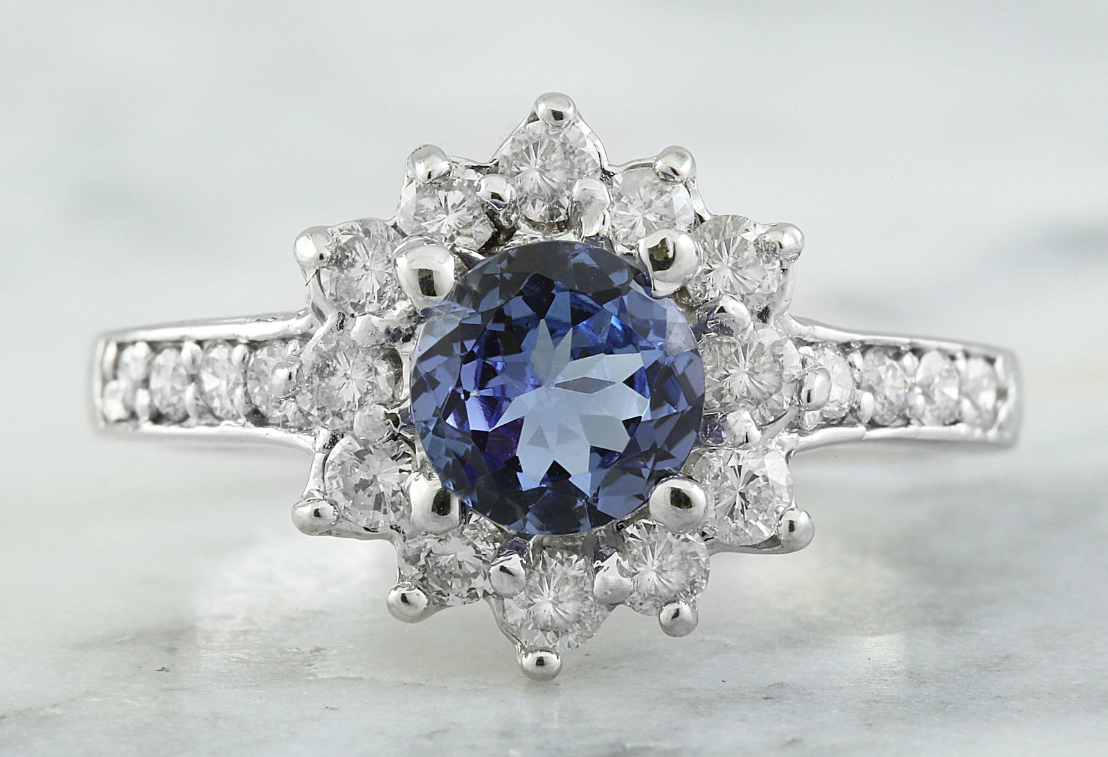 1.88 CTW Tanzanite 14K White Gold Diamond Ring: 1.88 CTW Tanzanite 14K White Gold Diamond Ring Manufacturer's Suggested Retail Price: $ 3500.00 Stamped: 14K Ring Size: 7 Total Ring Weight: 5 Grams Tanzanite Weight: 1.20 Carat (7.00x7.00 Millimeters