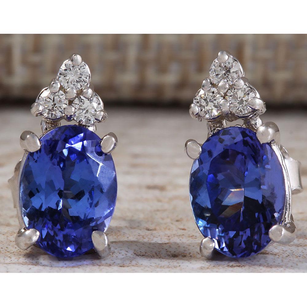 3.00 CTW Natural Blue Tanzanite And Diamond Earrings 18K Solid White Gold: 3.00 CTW Natural Blue Tanzanite And Diamond Earrings 18K Solid White Gold Manufacturer's Suggested Retail Price: $ 2700.00 Stamped: 18K Total Earring Weight: 2.5Grams Diamond Weight: Total Natural dia