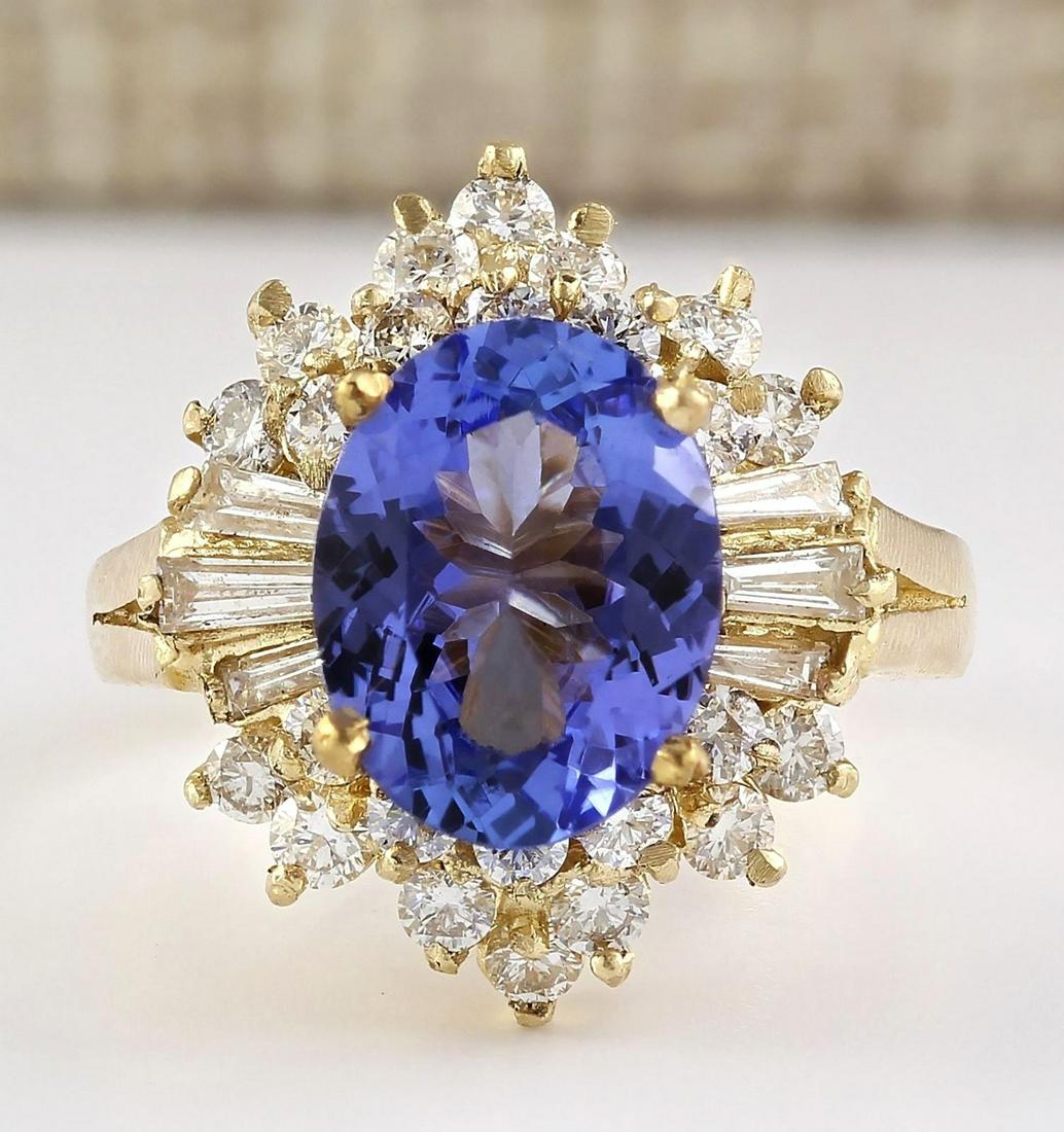 4.62 CTW Natural Tanzanite And Diamond Ring In 18K Yellow Gold: 4.62 CTW Natural Tanzanite And Diamond Ring In 18K Yellow Gold Manufacturer's Suggested Retail Price: $ 6200.00 Stamped: 18K Ring Size: 6 Total Ring Weight: 7.1 Grams Diamond Weight: Total Natural dia