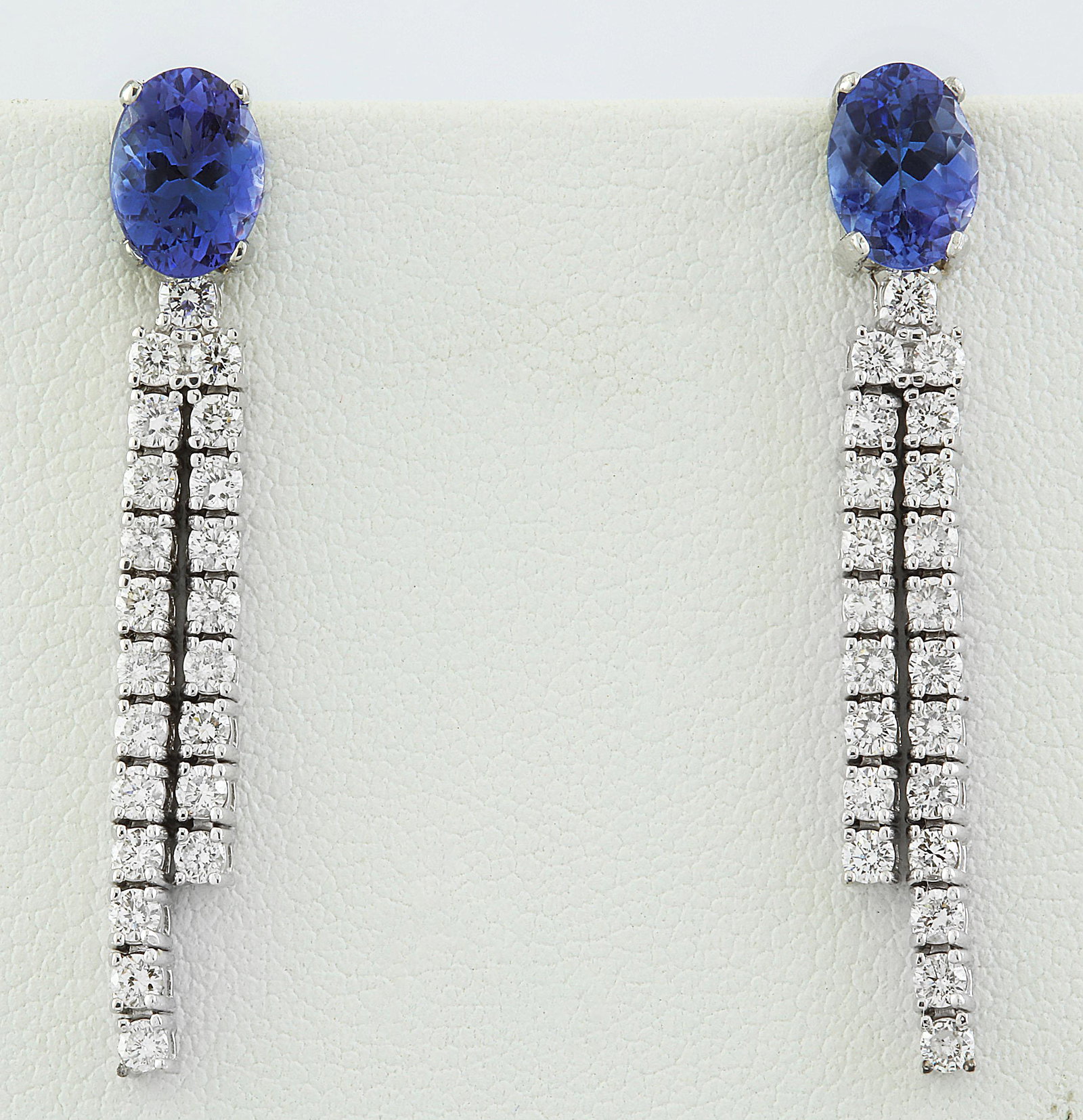 3.20 CTW Tanzanite 14K White Gold Diamond Earrings: 3.20 CTW Tanzanite 14K White Gold Diamond Earrings Manufacturer's Suggested Retail Price: $ 4200.00 Stamped: 14K Total Earrings Weight: 4.4 Grams Tanzanite Weight: 2.10 Carat (7.45x5.45 Millimeters) D