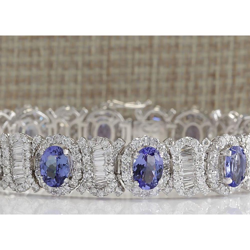 24.70 CTW Natural Tanzanite And Diamond Bracelet In 18K Solid White Gold: 24.70 CTW Natural Tanzanite And Diamond Bracelet In 18K Solid White Gold Manufacturer's Suggested Retail Price: $ 31000.00 Stamped: 18K Bracelet Width: 11.25mm Bracelet Length: 7.0 Inches Total Bracel