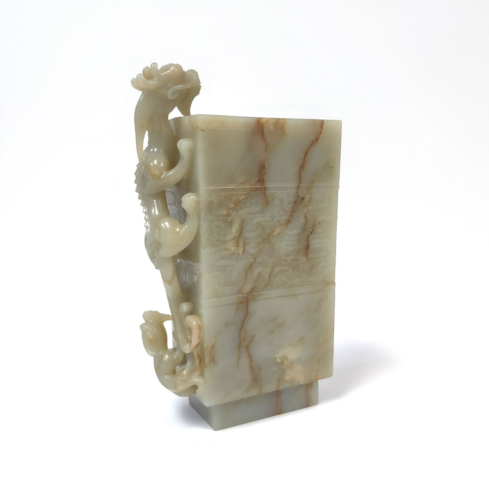 CHINESE ANTIQUE JADE BRUSH POT: Measures: 9-7/8" H x 5-1/4" W Chinese antique Jade Brush Pot. The exterior carved with archaic geometrical motif ribbon. A PiXiu dragon climbed toward the rectangle opening on one side. Natural Jade.