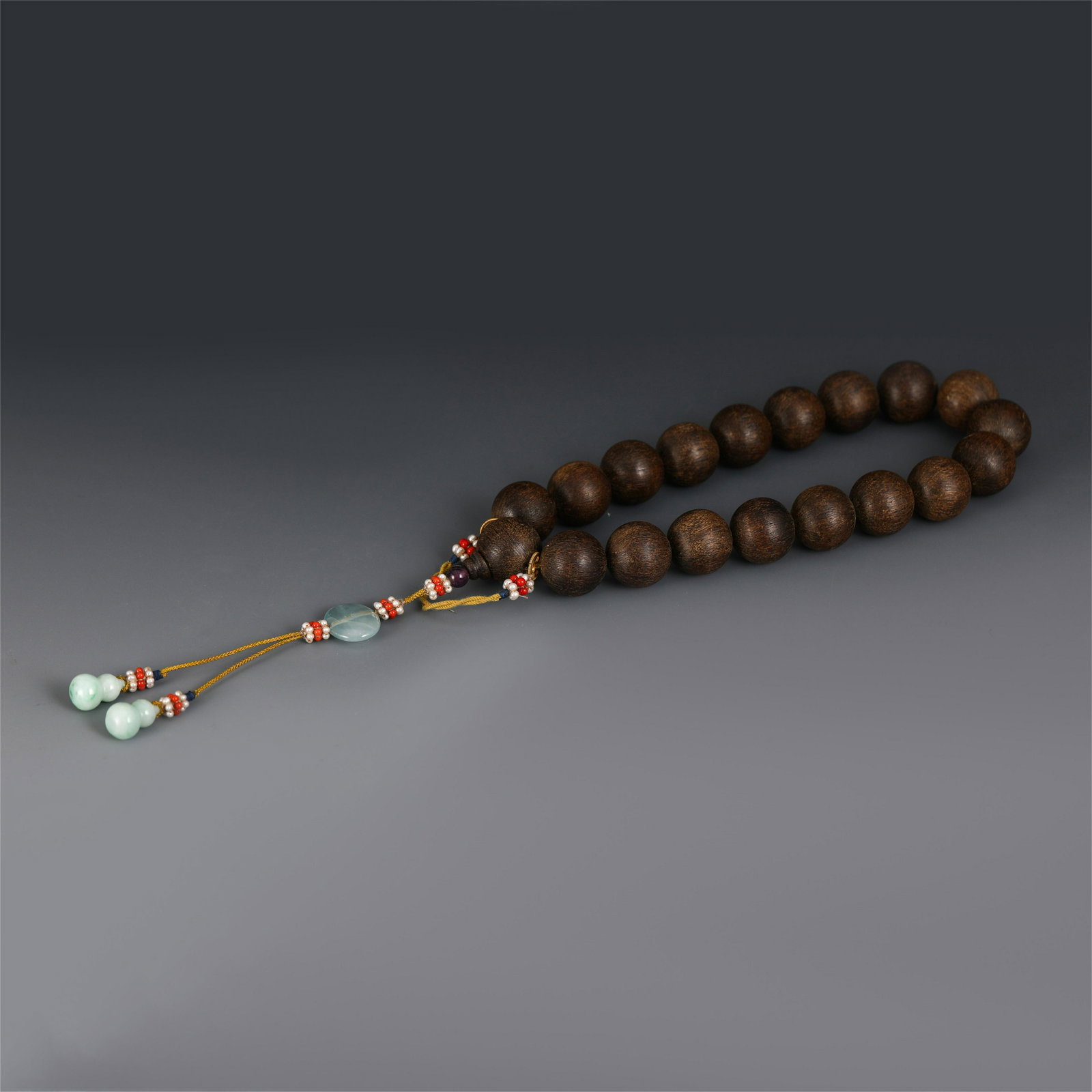 AGARWOOD CARVED BEADS BUDDHIST PRAYER BRACELET: Chinese Agarwood Carved Beads Buddhist Prayer Bracelet. Dimensions: Diam.: 12.2 cm Weight: 180 gram.